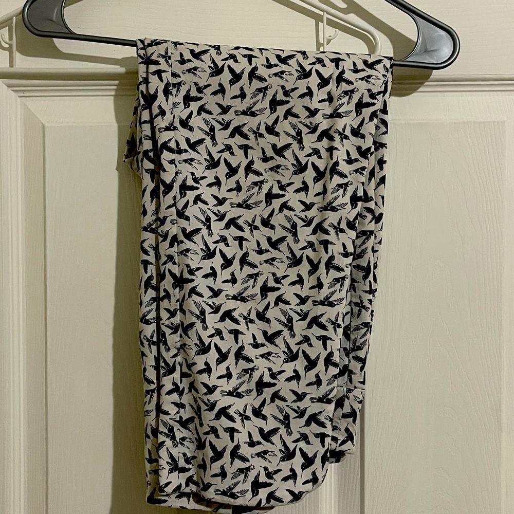 Size 10 White and Black Capris with a humming bird design created by “Up” Pants